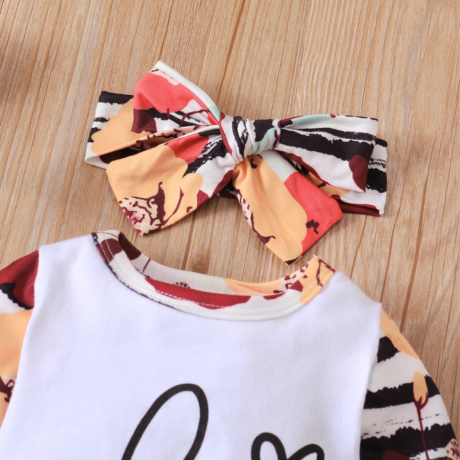 Macacão Infantil Feminino com Touca e Laço